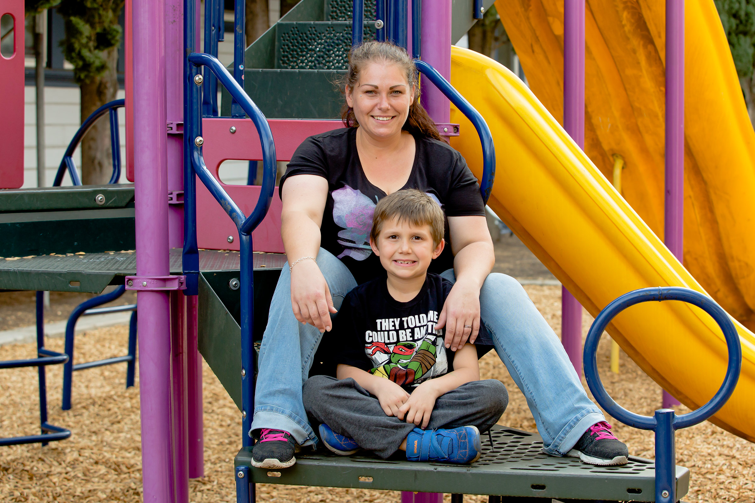 Mother-and-son-sitting-on-the-GCRM-playground-together